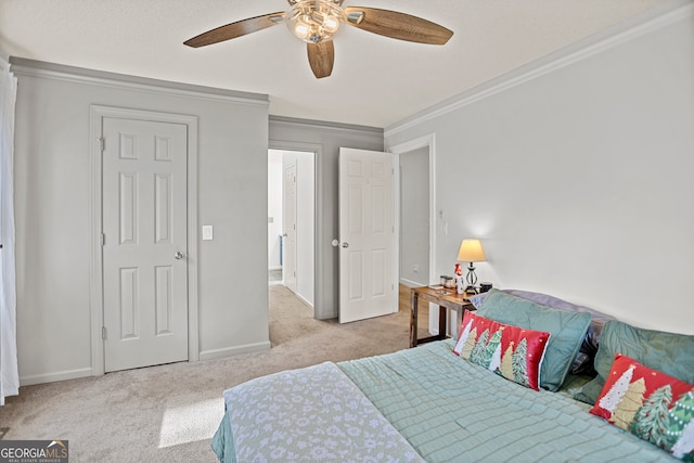 bedroom featuring light colored carpet, ceiling fan, and ornamental molding