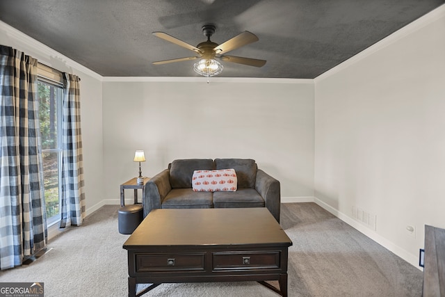 carpeted living room featuring ceiling fan, crown molding, and a textured ceiling