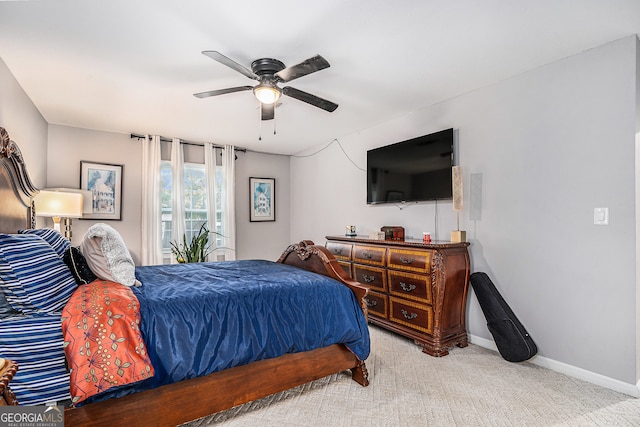 bedroom with light colored carpet and ceiling fan