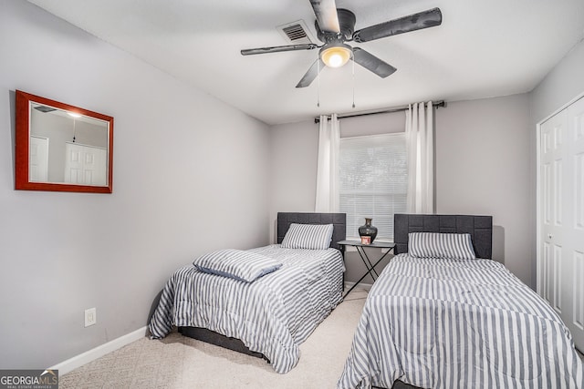 bedroom with light carpet and ceiling fan