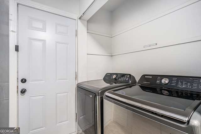 washroom with separate washer and dryer