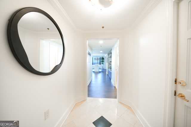 hallway featuring light wood-type flooring and crown molding