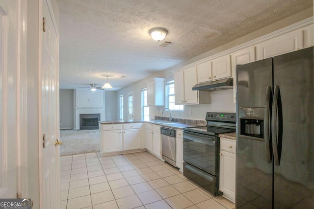 kitchen featuring white cabinetry, ceiling fan, a textured ceiling, light tile patterned floors, and black appliances