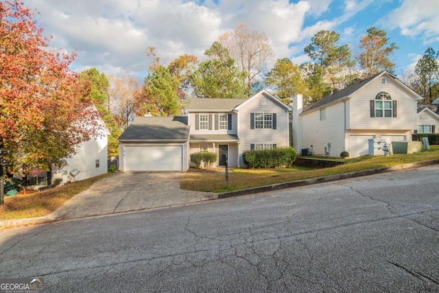 view of front of house featuring a front yard and a garage