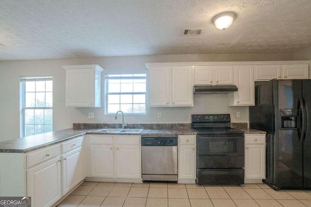 kitchen featuring black appliances, plenty of natural light, kitchen peninsula, and sink