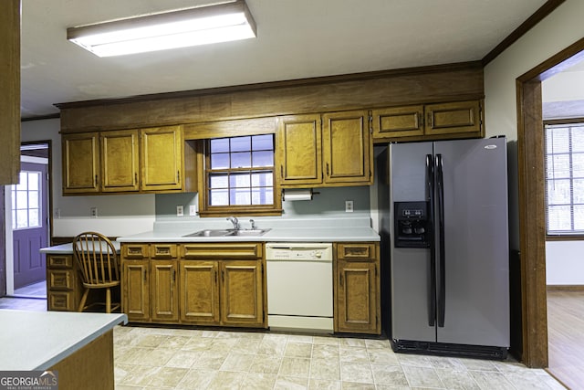 kitchen featuring stainless steel refrigerator with ice dispenser, crown molding, sink, dishwasher, and light hardwood / wood-style floors