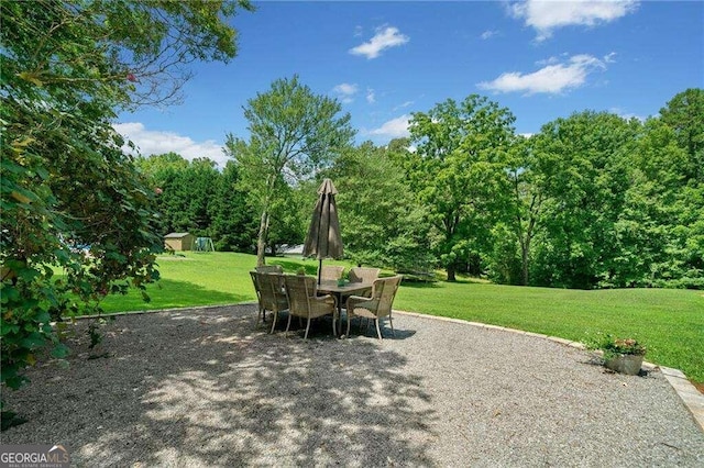 view of patio / terrace with a shed