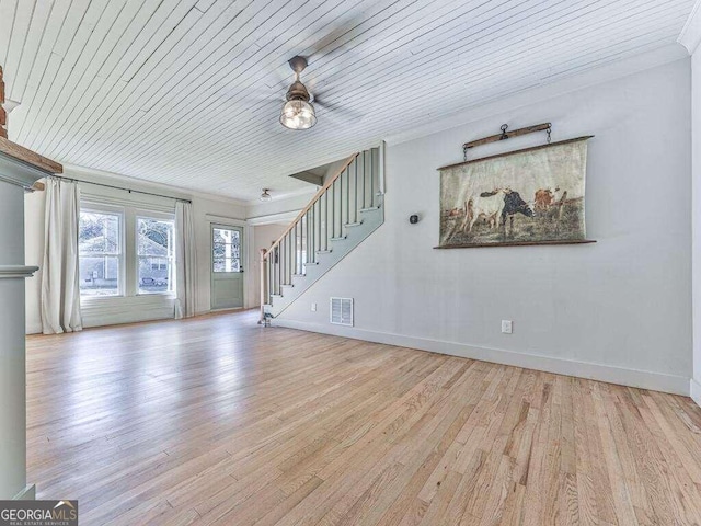 unfurnished living room with ceiling fan, crown molding, wood ceiling, and light wood-type flooring