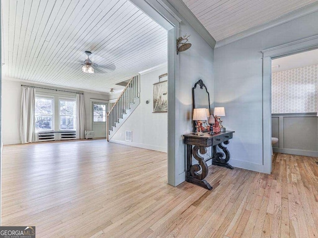 entrance foyer featuring ceiling fan, ornamental molding, wood ceiling, and light hardwood / wood-style flooring