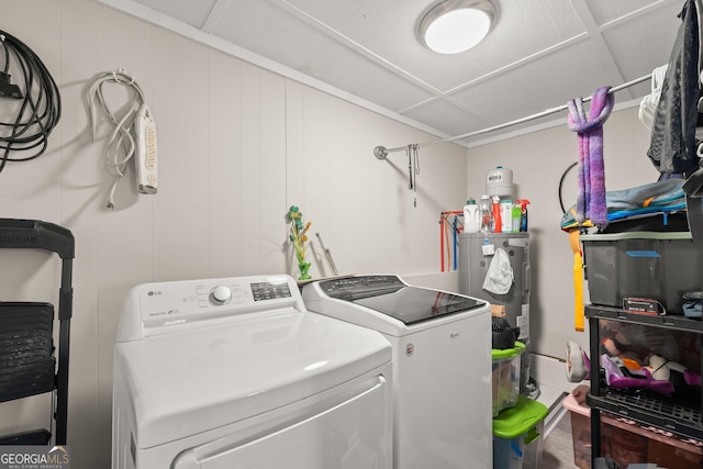 clothes washing area with washing machine and clothes dryer