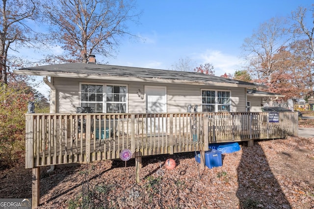 view of front of property featuring a wooden deck