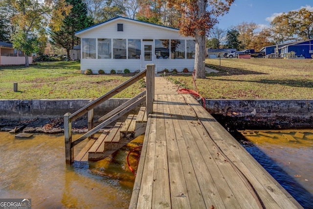 dock area with a lawn