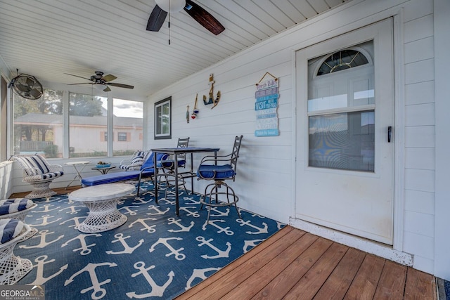 sunroom / solarium with ceiling fan