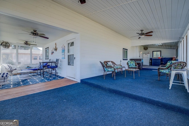 view of patio / terrace featuring an outdoor hangout area, a deck, and ceiling fan