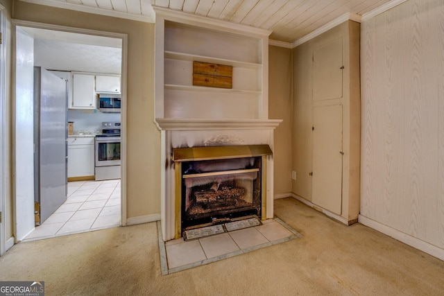 room details featuring wood ceiling, carpet floors, ornamental molding, and appliances with stainless steel finishes