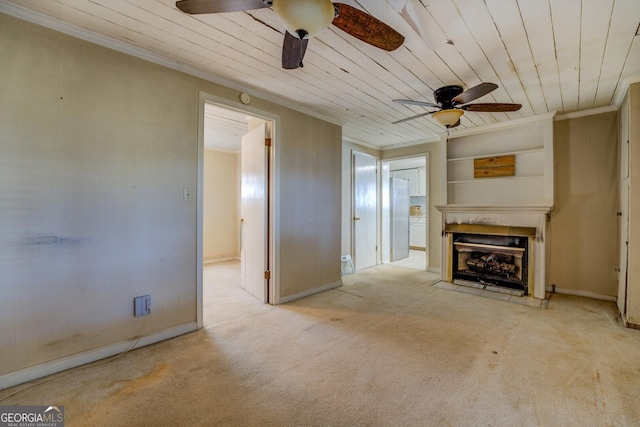 unfurnished living room featuring ceiling fan, ornamental molding, light carpet, built in shelves, and wooden ceiling