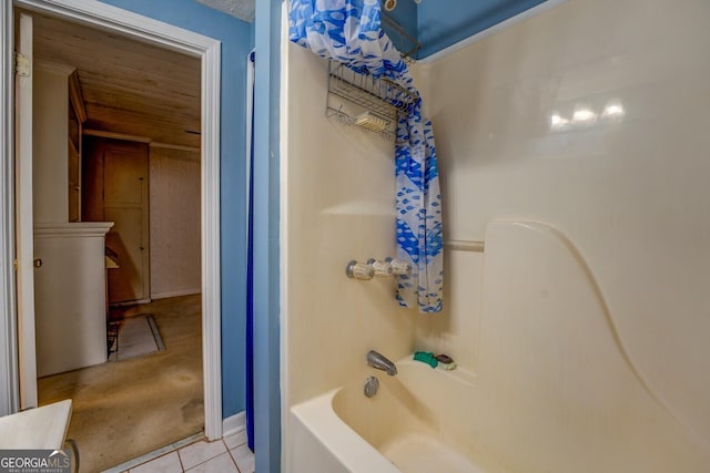 bathroom featuring shower / bathtub combination, tile patterned floors, and wooden ceiling