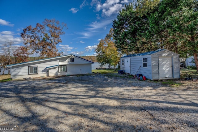 view of front of house featuring a shed