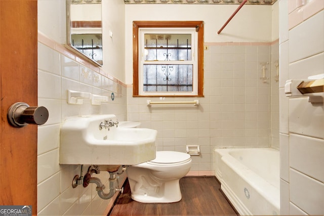 bathroom featuring hardwood / wood-style floors, toilet, tile walls, and sink