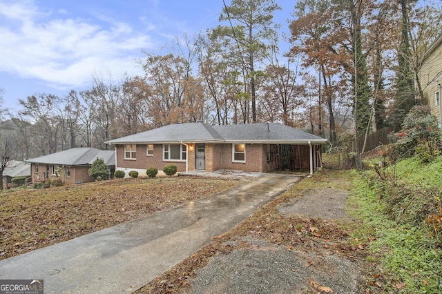 single story home featuring a carport