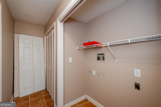 laundry room with tile patterned floors, washer hookup, a textured ceiling, and hookup for an electric dryer