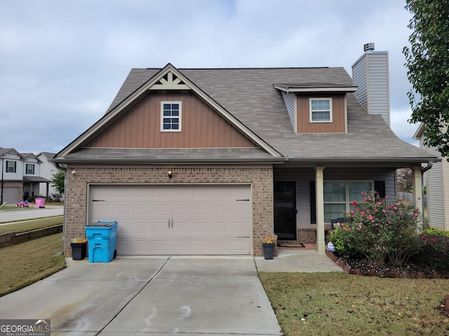 craftsman-style house with a garage and a front yard