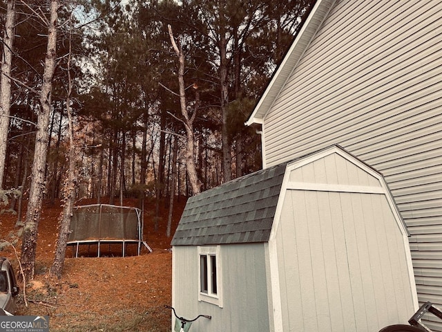 view of outbuilding with a trampoline