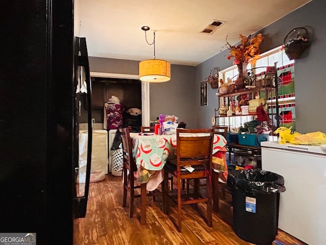 dining area featuring hardwood / wood-style floors