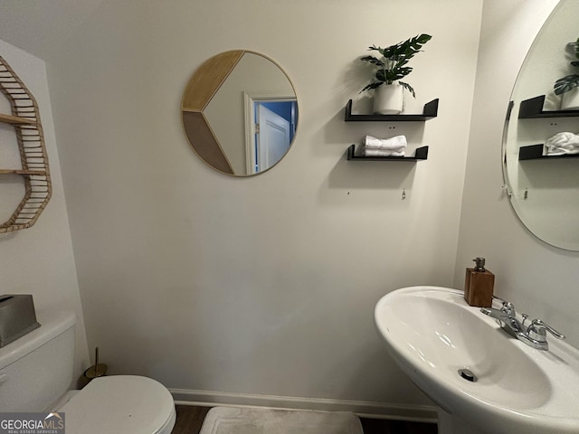 bathroom with sink and toilet