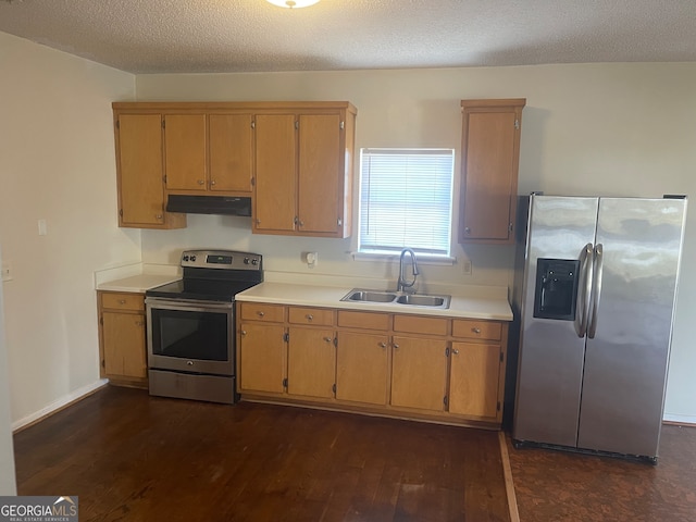 kitchen with a textured ceiling, sink, dark hardwood / wood-style floors, and appliances with stainless steel finishes