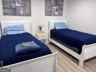 bedroom featuring wood-type flooring