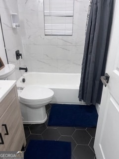 full bathroom featuring toilet, shower / tub combo, vanity, and tile patterned floors