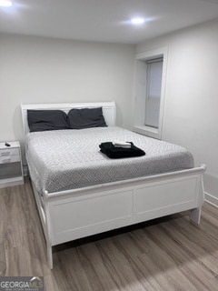 bedroom featuring hardwood / wood-style flooring