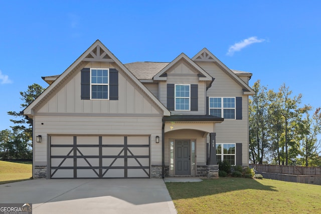 craftsman-style home with a garage and a front yard