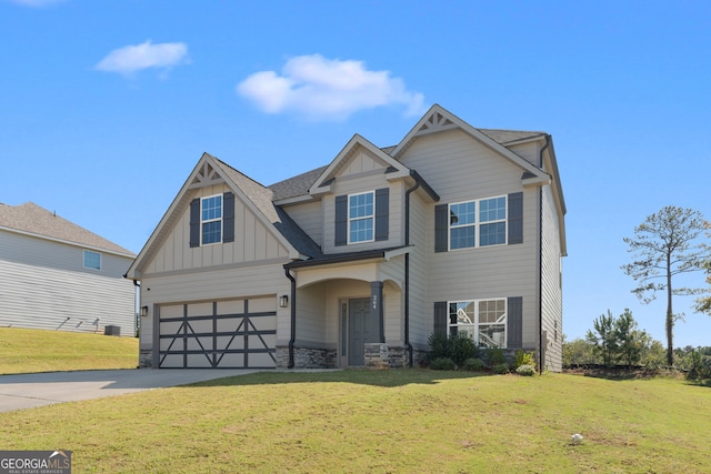 craftsman inspired home with a garage and a front lawn