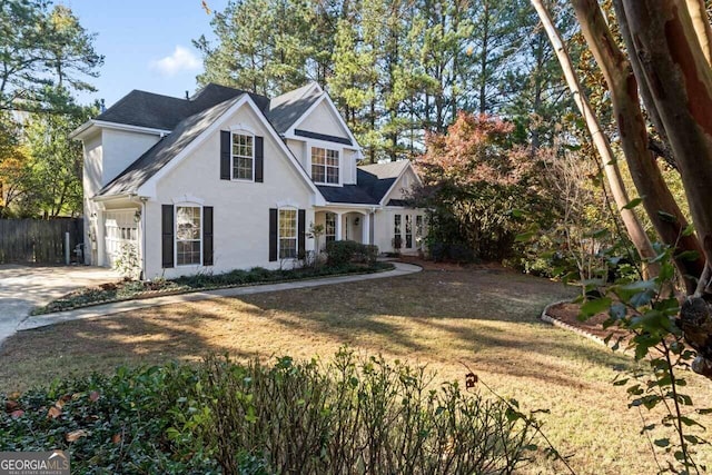 view of front facade with a front yard and a garage