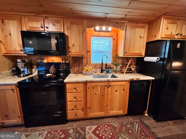 kitchen with black appliances, light stone countertops, wood ceiling, and sink