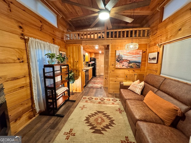 living room with lofted ceiling with beams, dark hardwood / wood-style floors, wooden ceiling, and wood walls