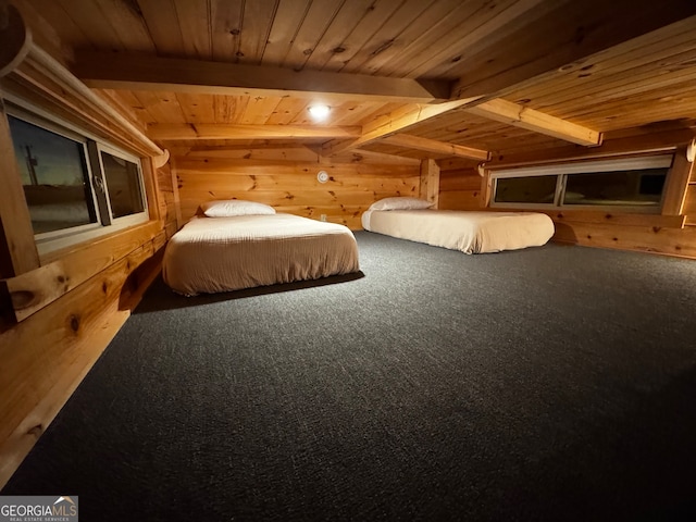 carpeted bedroom featuring beam ceiling, wooden walls, and wood ceiling