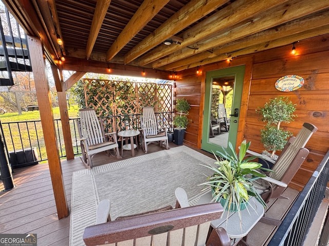 wooden terrace featuring covered porch