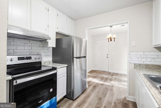 kitchen with a chandelier, white cabinets, light hardwood / wood-style floors, and appliances with stainless steel finishes