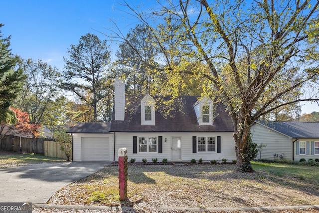 cape cod-style house with a garage