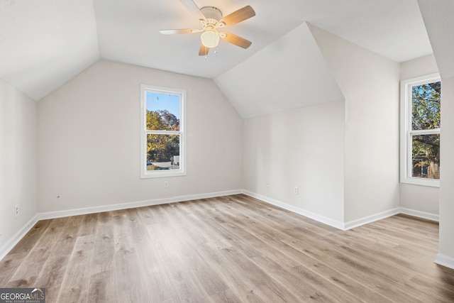 bonus room featuring ceiling fan, light hardwood / wood-style floors, and lofted ceiling