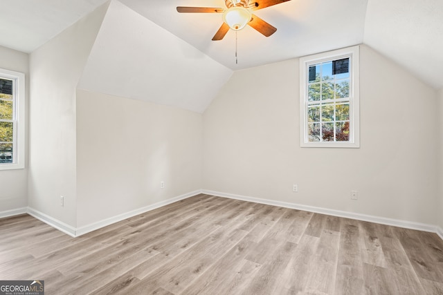 additional living space featuring light hardwood / wood-style floors, ceiling fan, and lofted ceiling