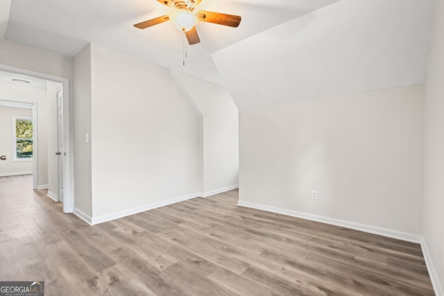 bonus room featuring ceiling fan, lofted ceiling, and light wood-type flooring