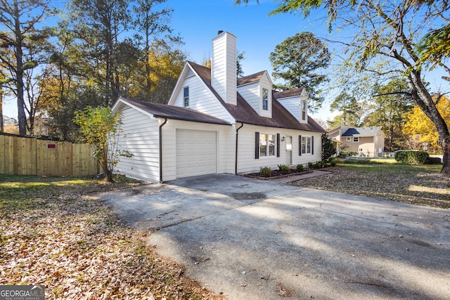 view of side of home featuring a garage