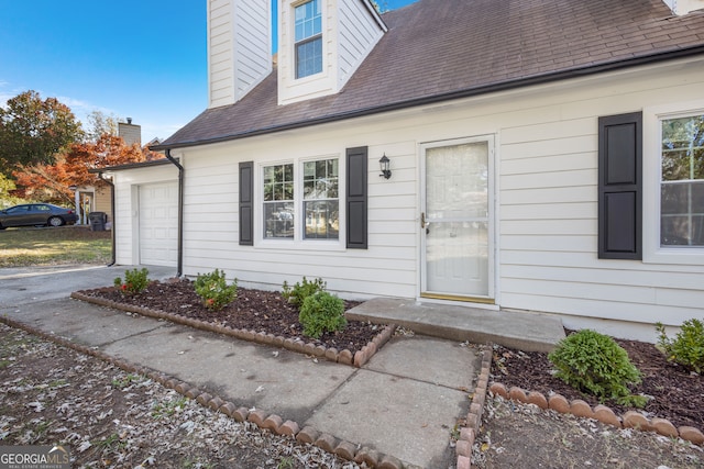 exterior space with a garage