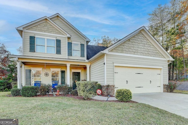 craftsman-style home with a porch, a garage, and a front yard