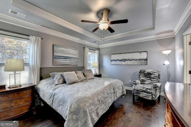 bedroom featuring multiple windows, ceiling fan, dark wood-type flooring, and ornamental molding