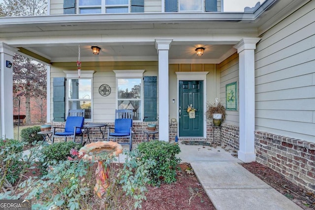 entrance to property with covered porch